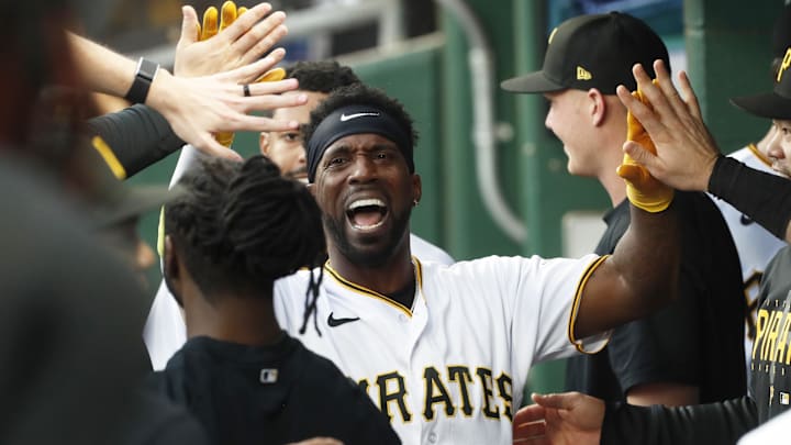 May 23, 2023; Pittsburgh, Pennsylvania, USA; Pittsburgh Pirates designated hitter Andrew McCutchen (22) celebrates with teammates in the dugout after scoring a run against the Texas Rangers during the third inning at PNC Park. Mandatory Credit: Charles LeClaire-Imagn Images