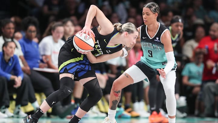 Dallas Wings guard Paige Bueckers (5) looks to drive past New York Liberty guard Natasha Cloud (9) in the third quarter at Barclays Center.