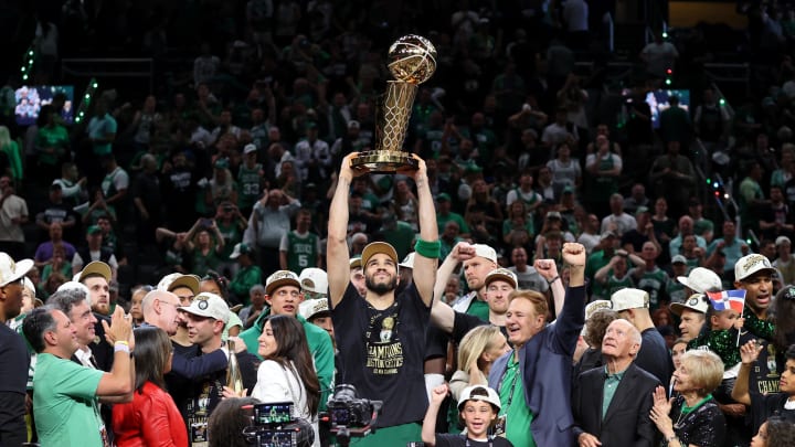 Jun 17, 2024; Boston, Massachusetts, USA; Boston Celtics forward Jayson Tatum (0) lifts the trophy after winning the 2024 NBA Finals against the Dallas Mavericks at TD Garden. Mandatory Credit: Peter Casey-USA TODAY Sports Jun 17, 2024; Boston, Massachusetts, USA; Boston Celtics forward Jayson Tatum (0) lifts the trophy after winning the 2024 NBA Finals against the Dallas Mavericks at TD Garden. Mandatory Credit: Peter Casey-USA TODAY Sports