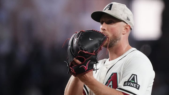 May 18, 2025; Phoenix, Ariz., U.S.; Arizona Diamondbacks Merrill Kelly (29) pitches against the Colorado Rockies at Chase Field in Phoenix on May 18, 2025. May 18, 2025; Phoenix, Ariz., U.S.; Arizona Diamondbacks Merrill Kelly (29) pitches against the Colorado Rockies at Chase Field in Phoenix on May 18, 2025.