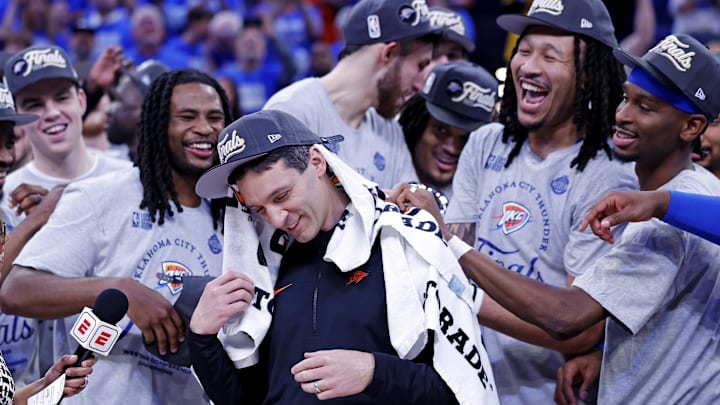 May 28, 2025; Oklahoma City, Oklahoma, USA; Oklahoma City Thunder head coach Mark Daigneault celebrates with his team after defeating the Minnesota Timberwolves in game five to win the western conference finals for the 2025 NBA Playoffs at Paycom Center. Mandatory Credit: Alonzo Adams-Imagn Images