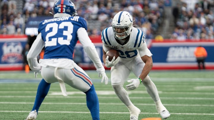 Indianapolis Colts running back Jonathan Taylor (28) runs after catching a pass before being tackled by New York Giants safety Anthony Johnson Jr. (23) during a game between New York Giants and Indianapolis Colts at MetLife Stadium on Sunday, Dec. 29, 2024. Indianapolis Colts running back Jonathan Taylor (28) runs after catching a pass before being tackled by New York Giants safety Anthony Johnson Jr. (23) during a game between New York Giants and Indianapolis Colts at MetLife Stadium on Sunday, Dec. 29, 2024.