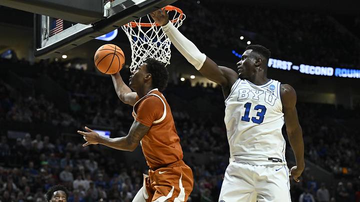 Mar 19, 2026; Portland, OR, USA; Texas Longhorns forward Dailyn Swain (3) shoots against BYU Cougars center Keba Keita (13) in the second half during a first round game of the men's 2026 NCAA Tournament at Moda Center. Mandatory Credit: Craig Strobeck-Imagn Images