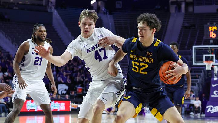 Mar 3, 2026; Manhattan, Kansas, USA; West Virginia Mountaineers guard Tresen Eaglestaff (52) is guarded by Kansas State Wildcats forward Andrej Kostic (47) during the first half at Bramlage Coliseum. Mandatory Credit: Scott Sewell-Imagn Images