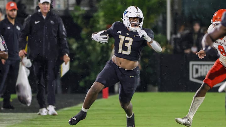 Sep 7, 2024; Orlando, Florida, USA; UCF Knights running back Peny Boone (13) runs the ball during the second half against the Sam Houston State Bearkats at FBC Mortgage Stadium. Mandatory Credit: Mike Watters-Imagn Images Sep 7, 2024; Orlando, Florida, USA; UCF Knights running back Peny Boone (13) runs the ball during the second half against the Sam Houston State Bearkats at FBC Mortgage Stadium. Mandatory Credit: Mike Watters-Imagn Images
