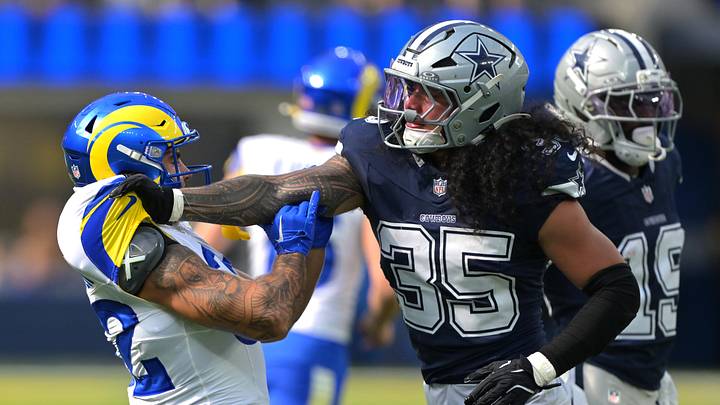 Dallas Cowboys linebacker Marist Liufau grabs a hold of Los Angeles Rams running back Cody Schrader. Dallas Cowboys linebacker Marist Liufau grabs a hold of Los Angeles Rams running back Cody Schrader.