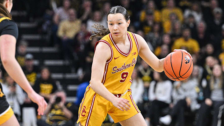 Feb 2, 2025; Iowa City, Iowa, USA; USC Trojans guard Kayleigh Heckel (9) controls the ball against the USC Trojans during the first quarter at Carver-Hawkeye Arena. Mandatory Credit: Jeffrey Becker-Imagn Images
