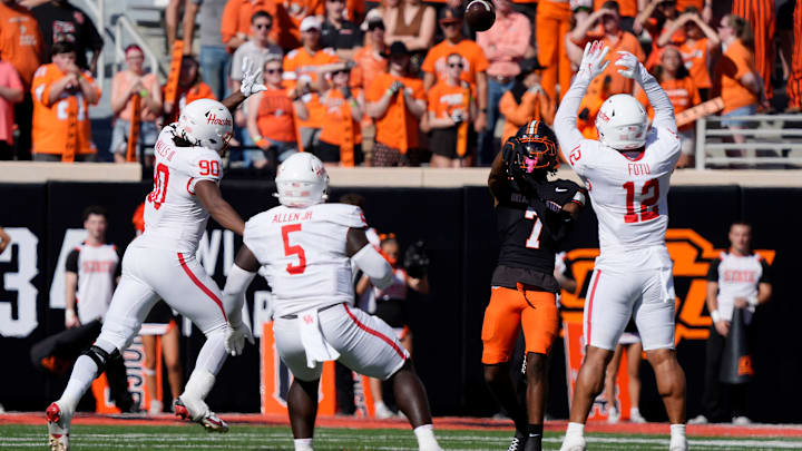 Oklahoma State Cowboys wide receiver Shamar Rigby (7) throws a touchdown pass during a college football game between the Oklahoma State Cowboys (OSU) and the Houston Cougars at Boone Pickens Stadium in Stillwater, Okla., Saturday, Oct. 11, 2025.