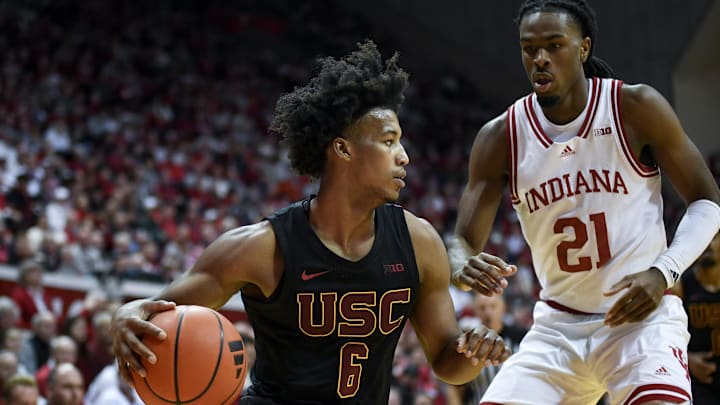 Jan 8, 2025; Bloomington, Indiana, USA; USC Trojans guard Wesley Yates III (6) goes to the basket against Indiana Hoosiers forward Mackenzie Mgbako (21) during the second half at Simon Skjodt Assembly Hall. Mandatory Credit: Robert Goddin-Imagn Images