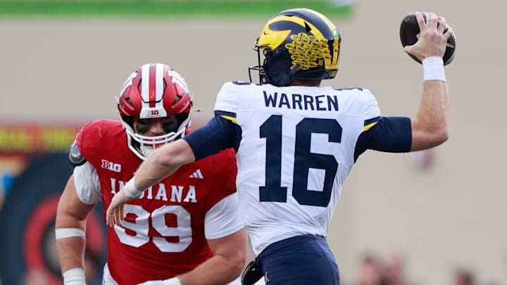 Michigan Wolverines quarterback Davis Warren (16) throws...