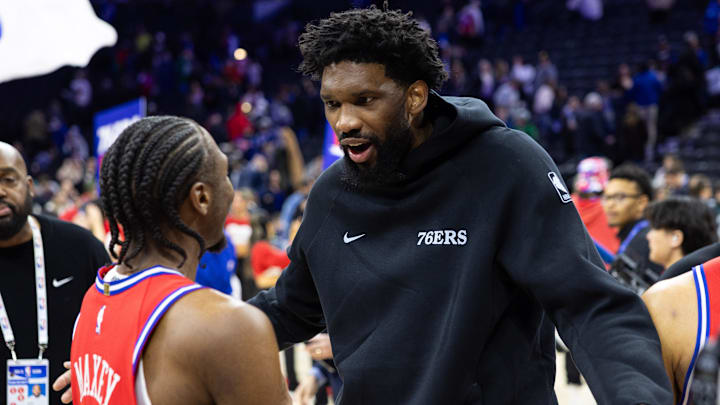 Jan 24, 2025; Philadelphia, Pennsylvania, USA; Philadelphia 76ers guard Tyrese Maxey (L) reacts with injured Joel Embiid (R) after a victory against the Cleveland Cavaliers at Wells Fargo Center. Mandatory Credit: Bill Streicher-Imagn Images Jan 24, 2025; Philadelphia, Pennsylvania, USA; Philadelphia 76ers guard Tyrese Maxey (L) reacts with injured Joel Embiid (R) after a victory against the Cleveland Cavaliers at Wells Fargo Center. Mandatory Credit: Bill Streicher-Imagn Images