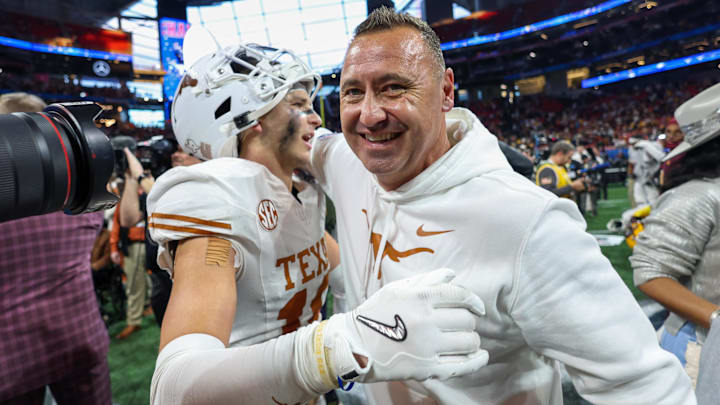 Jan 1, 2025; Atlanta, GA, USA; Texas Longhorns defensive back Michael Taaffe (16) and head coach Steve Sarkisian celebrate after a victory over the Arizona State Sun Devils. Jan 1, 2025; Atlanta, GA, USA; Texas Longhorns defensive back Michael Taaffe (16) and head coach Steve Sarkisian celebrate after a victory over the Arizona State Sun Devils.