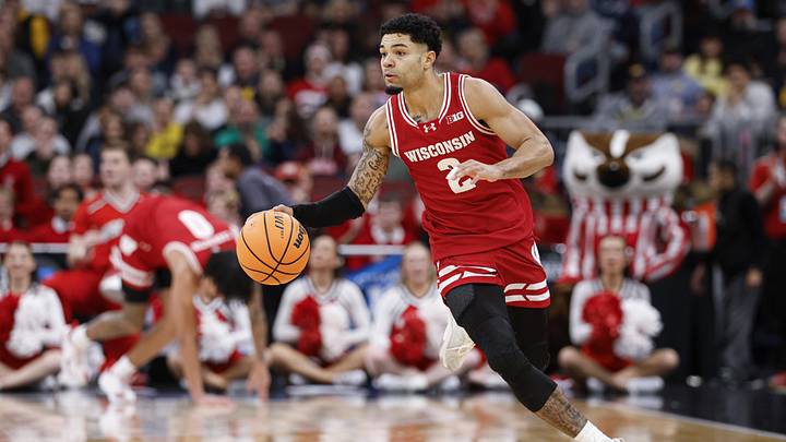 Mar 14, 2026; Chicago, IL, USA; Wisconsin Badgers guard Nick Boyd (2) brings the ball up court against the Michigan Wolverines during the first half at United Center. Mandatory Credit: Kamil Krzaczynski-Imagn Images