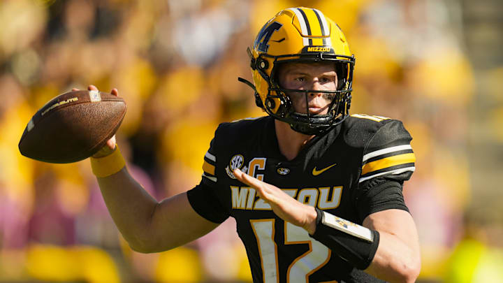 Oct 19, 2024; Columbia, Missouri, USA; Missouri Tigers quarterback Brady Cook (12) throws a pass during the second half against the Auburn Tigers at Faurot Field at Memorial Stadium. Mandatory Credit: Jay Biggerstaff-Imagn Images