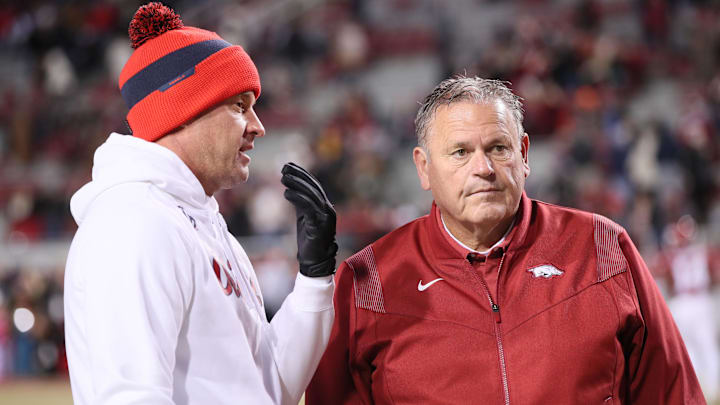 Ole Miss Rebels head coach Lane Kiffin talks to Arkansas Razorbacks head coach Sam Pittman prior to the game at Donald W. Reynolds Razorback Stadium. 
