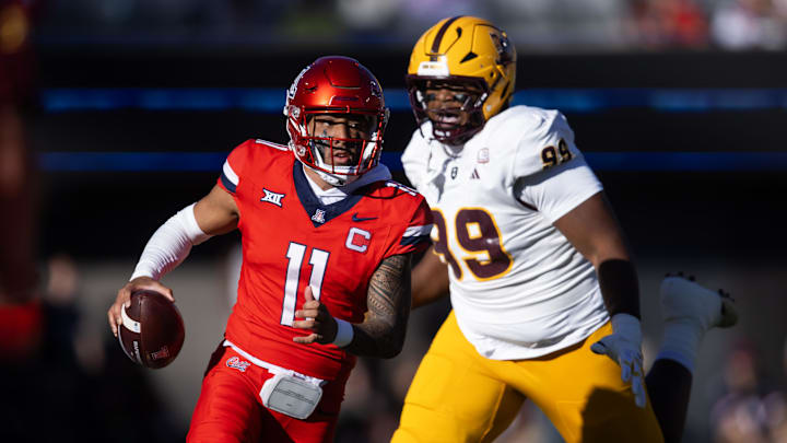 Nov 30, 2024; Tucson, Arizona, USA; Arizona Wildcats quarterback Noah Fifita (11) against the Arizona State Sun Devils during the Territorial Cup at Arizona Stadium. Mandatory Credit: Mark J. Rebilas-Imagn Images
