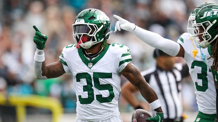 Dec 15, 2024; Jacksonville, Florida, USA; New York Jets safety Jalen Mills (35) celebrates after an interception against the Jacksonville Jaguars in the first quarter at EverBank Stadium. Mandatory Credit: Nathan Ray Seebeck-Imagn Images