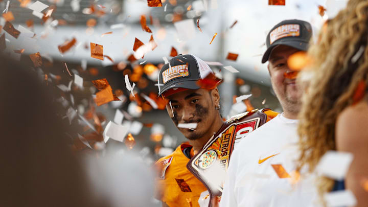 Jan 1, 2024; Orlando, FL, USA; Tennessee Volunteers quarterback Nico Iamaleava (8) poses with the MVP Trophy after defeating the Iowa Hawkeyes at Camping World Stadium. Mandatory Credit: Morgan Tencza-USA TODAY Sports