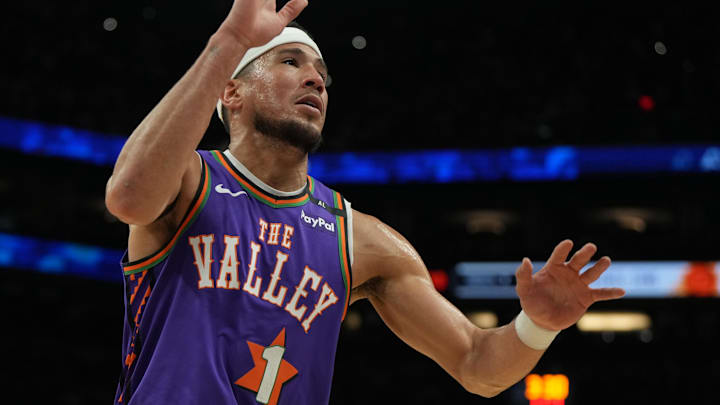 Mar 30, 2025; Phoenix, Arizona, USA; Phoenix Suns guard Devin Booker (1) hustles after the ball against the Houston Rockets in the first half at Footprint Center. Mandatory Credit: Rick Scuteri-Imagn Images