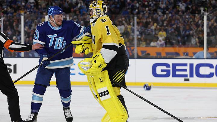 Feb 1, 2026; Tampa Bay, Florida, USA; Tampa Bay Lightning defenseman Darren Raddysh (43) attempts to hold back Boston Bruins goaltender Jeremy Swayman (1), who skated to mid-ice to fight goaltender Andrei Vasilevskiy during the second period in the 2026 Stadium Series ice hockey game at Raymond James Stadium. Mandatory Credit: Kim Klement Neitzel-Imagn Images