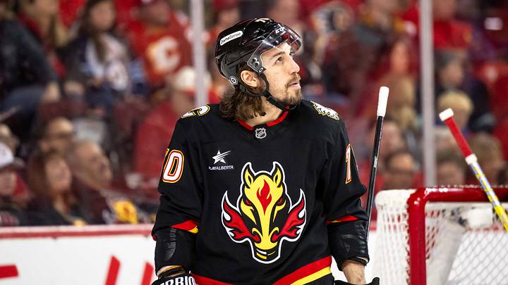 Mar 25, 2025; Calgary, Alberta, CAN; Calgary Flames left wing Ryan Lomberg (70) looks on between whistles during the third period against the Seattle Kraken at Scotiabank Saddledome. Mandatory Credit: Brett Holmes-Imagn Images
