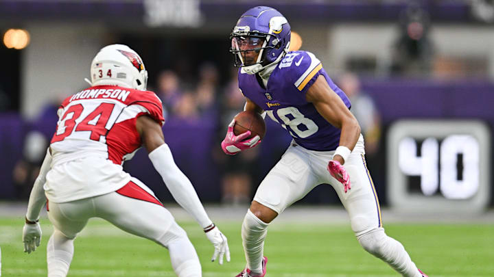 Oct 30, 2022; Minneapolis, Minnesota, USA; Minnesota Vikings wide receiver Justin Jefferson (18) gets yards after the catch as Arizona Cardinals safety Jalen Thompson (34) moves in for the tackle during the third quarter at U.S. Bank Stadium.