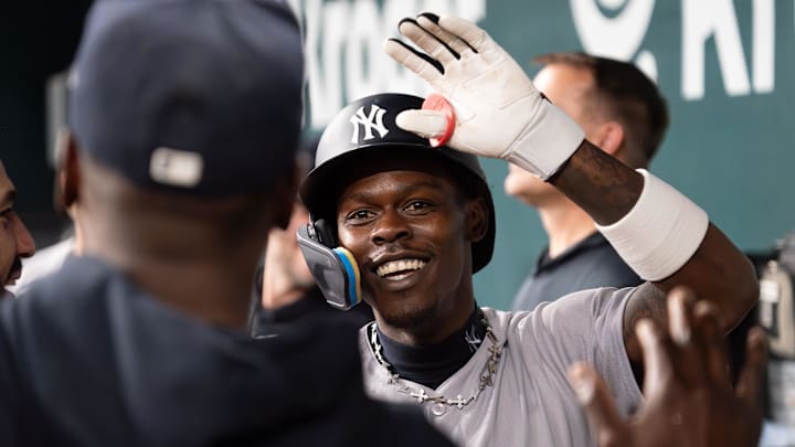 Apr 27, 2026; Arlington, Texas, USA; New York Yankees second baseman Jazz Chisholm Jr. (13) high fives teammates in the dugout after hitting a solo home run during the fourth inning at Globe Life Field. Mandatory Credit: Raymond Carlin III-Imagn Images