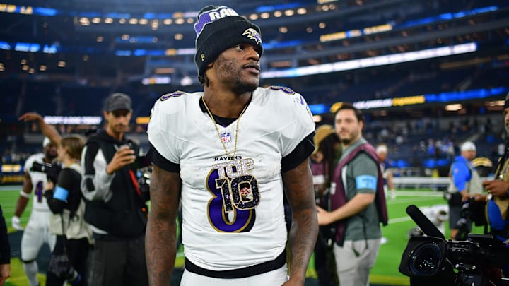 Nov 25, 2024; Inglewood, California, USA; Baltimore Ravens quarterback Lamar Jackson (8) reacts following the victory against the Los Angeles Chargers at SoFi Stadium. Mandatory Credit: Gary A. Vasquez-Imagn Images