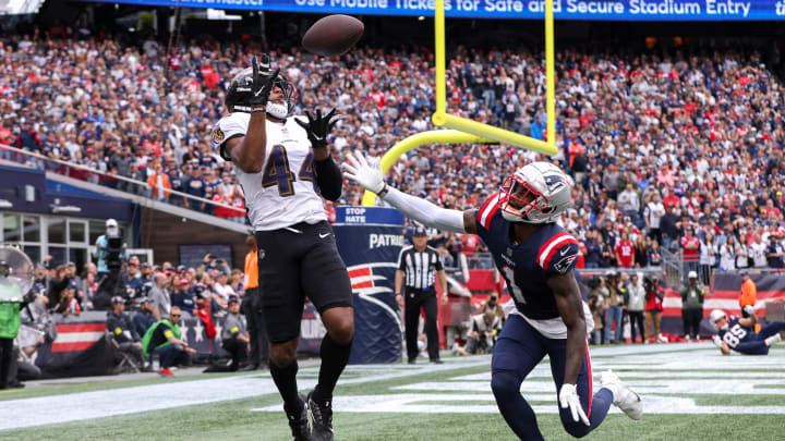 Sep 25, 2022; Foxborough, Massachusetts, USA; Baltimore Ravens cornerback Marlon Humphrey (44) intercepts the ball during the second half against the New England Patriots at Gillette Stadium. Mandatory Credit: Paul Rutherford-USA TODAY Sports