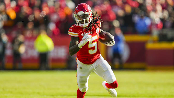 Dec 21, 2024; Kansas City, Missouri, USA; Kansas City Chiefs wide receiver Hollywood Brown (5) runs with the ball during the first half against the Houston Texans at GEHA Field at Arrowhead Stadium. Mandatory Credit: Jay Biggerstaff-Imagn Images