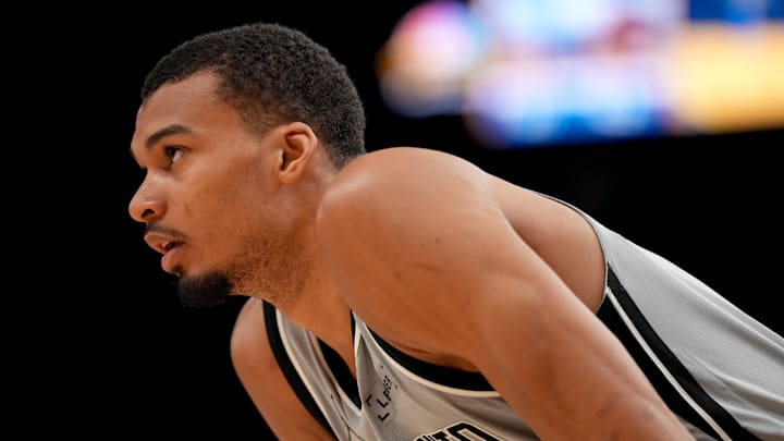 San Antonio Spurs center Victor Wembanyama stands on the court during a break in the action against the Golden State Warriors.