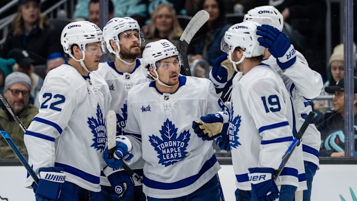 Jan 29, 2026; Seattle, Washington, USA; Toronto Maple Leafs, from left, defenseman Jake McCabe (22), defenseman Oliver Ekman-Larsson (95), forward Nicholas Robertson (89), forward Calle Jarnkrok (19) and forward Nicolas Roy (55) celebrate a goal during the first period at Climate Pledge Arena. Mandatory Credit: Stephen Brashear-Imagn Images