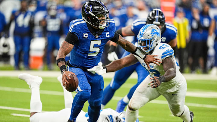 Detroit Lions defensive end Josh Paschal (93) tackles Indianapolis Colts quarterback Anthony Richardson (5) during the second half at Lucas Oil Stadium in Indianapolis, Ind. on Sunday, Nov. 24, 2024.