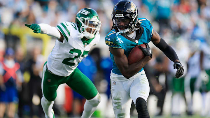Jacksonville Jaguars wide receiver Brian Thomas Jr. (7) rushes for yards en route to a touchdown against New York Jets cornerback Kendall Sheffield (27) during the fourth quarter Sunday, Dec. 15, 2024 at EverBank Stadium in Jacksonville, Fla. Jacksonville Jaguars wide receiver Brian Thomas Jr. (7) rushes for yards en route to a touchdown against New York Jets cornerback Kendall Sheffield (27) during the fourth quarter Sunday, Dec. 15, 2024 at EverBank Stadium in Jacksonville, Fla.