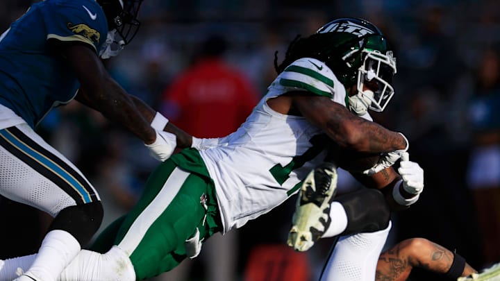 Jacksonville Jaguars safety Darnell Savage (6), from left, can’t stop New York Jets wide receiver Davante Adams (17) from scoring the game-winning touchdown as Jagaurs safety Antonio Johnson (26) loses his footing during the fourth quarter Sunday, Dec. 15, 2024 at EverBank Stadium in Jacksonville, Fla. The Jets held off the Jaguars 32-25.