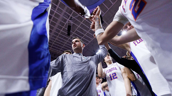 Feb 15, 2025; Gainesville, Florida, USA; Florida Gators head coach Todd Golden huddles with his team after a game against the South Carolina Gamecocks at Exactech Arena at the Stephen C. O'Connell Center. Mandatory Credit: Matt Pendleton-Imagn Images