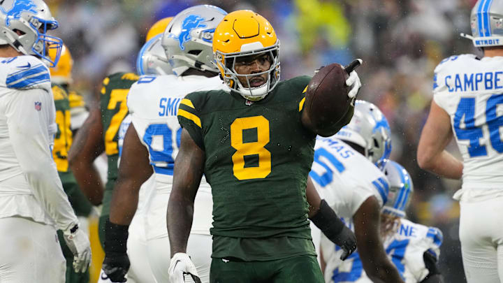 Nov 3, 2024; Green Bay, Wisconsin, USA;  Green Bay Packers running back Josh Jacobs (8) gestures after earning a first down during the first quarter against the Detroit Lions at Lambeau Field.