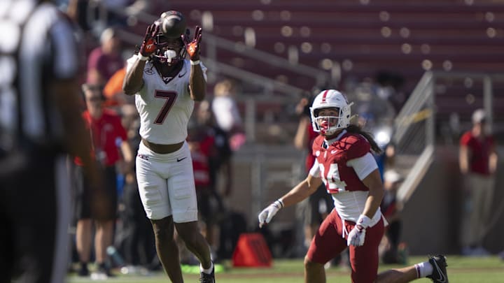 Virginia Tech Hokies DB/LB Keonta Jenkins intercepts the ball in front of Stanford Cardinal wide receiver Tiger Bachmeier during the fourth quarter at Stanford Stadium.