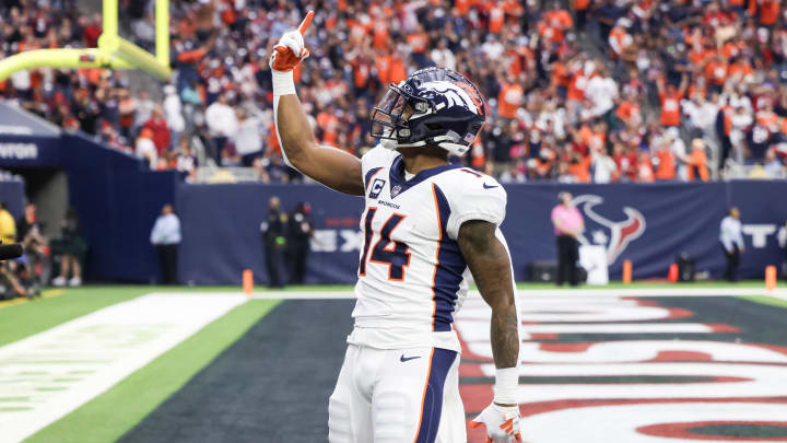Dec 3, 2023; Houston, Texas, USA; Denver Broncos wide receiver Courtland Sutton (14) celebrates his touchdown reception against the Houston Texans in the second half at NRG Stadium. 
