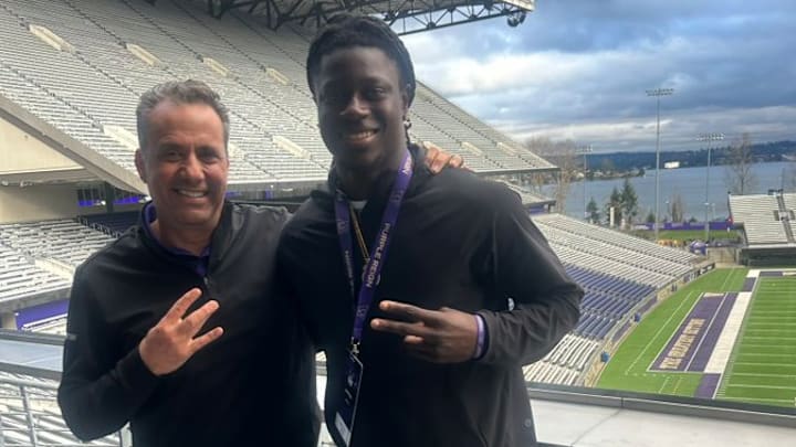 Jedd Fisch and receiver Dontay Tyson Jr. share a recruiting moment in March.