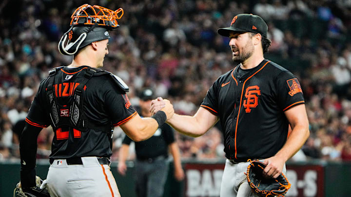 Jul 3, 2025; Phoenix, Arizona, USA; San Francisco Giants catcher Andrew Knizner (21) (left) and San Francisco Giants pitcher Robbie Ray (38) celebrate Ray’s complete game between the Arizona Diamondbacks and the San Francisco Giants at Chase Field.