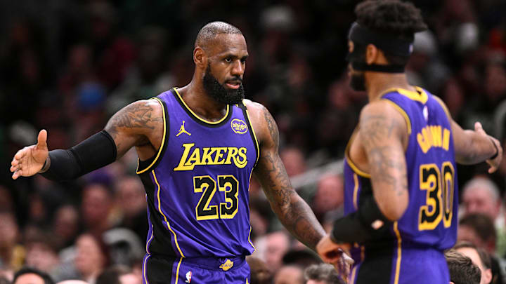 Mar 8, 2025; Boston, Massachusetts, USA; Los Angeles Lakers forward LeBron James (23) high-fives guard Jordan Goodwin (30)  during the second quarter of a game against the Boston Celtics at the TD Garden. Mandatory Credit: Brian Fluharty-Imagn Images