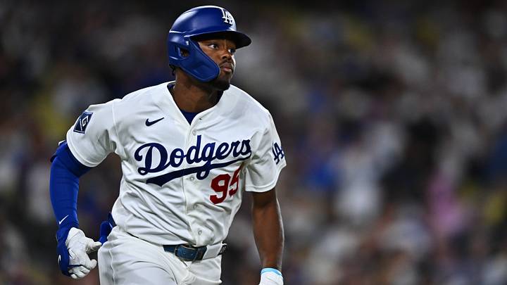 Sep 22, 2026; Los Angeles, California, USA; Los Angeles Dodgers designated hitter Josue De Paula (95) triples during the sixth inning against the San Diego Padres at Dodger Stadium.  Mandatory Credit: William Liang-Imagn Images