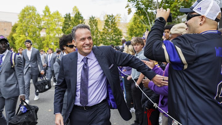 Oct 5, 2024; Seattle, Washington, USA; Washington Huskies head coach Jedd Fisch walks into Alaska Airlines Field at Husky Stadium before a game against the Michigan Wolverines. Mandatory Credit: Joe Nicholson-Imagn Images