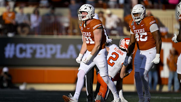 Texas Longhorns linebacker Ethan Burke celebrates after he sacks Clemson Tigers quarterback Cade Klubnik during the second quarter of the CFP National Playoff first round game