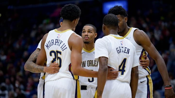 Dec 7, 2024; New Orleans, Louisiana, USA; New Orleans Pelicans guard Dejounte Murray (5) gathers teammates including New Orleans Pelicans guard Trey Murphy III (25) and New Orleans Pelicans guard Javonte Green (4) for a huddle as the team falls behind against the Oklahoma City Thunder during the first half at Smoothie King Center. Mandatory Credit: Matthew Hinton-Imagn Images Dec 7, 2024; New Orleans, Louisiana, USA; New Orleans Pelicans guard Dejounte Murray (5) gathers teammates including New Orleans Pelicans guard Trey Murphy III (25) and New Orleans Pelicans guard Javonte Green (4) for a huddle as the team falls behind against the Oklahoma City Thunder during the first half at Smoothie King Center. Mandatory Credit: Matthew Hinton-Imagn Images