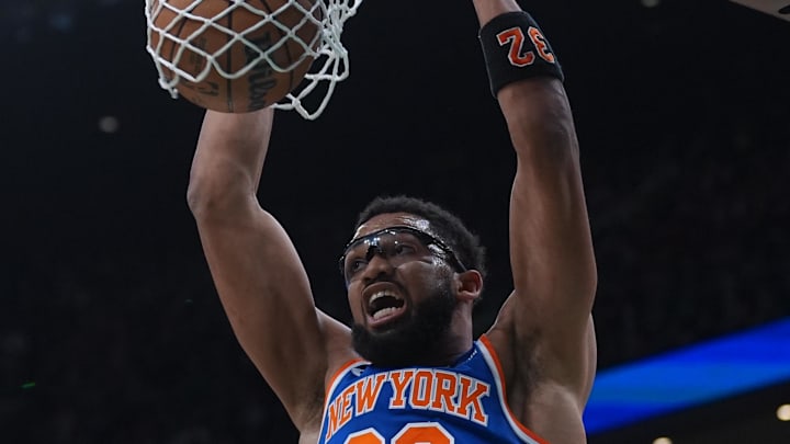 Feb 8, 2026; Boston, Massachusetts, USA; New York Knicks center Karl-Anthony Towns (32) makes the basket against the Boston Celtics in the first quarter at TD Garden. Mandatory Credit: David Butler II-Imagn Images