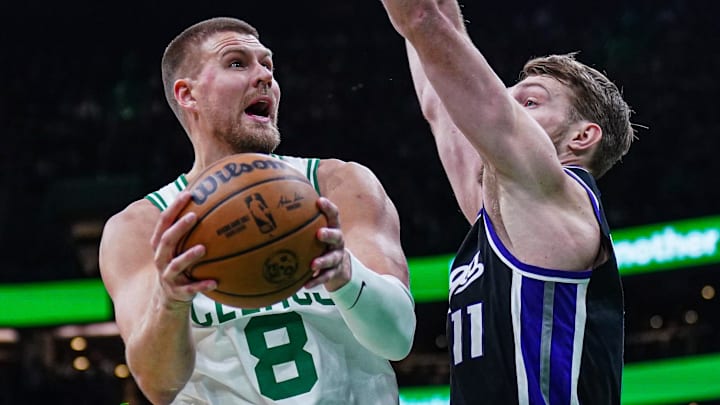 Jan 10, 2025; Boston, Massachusetts, USA; Sacramento Kings forward Domantas Sabonis (11) defends against Boston Celtics center Kristaps Porzingis (8) in the second half at TD Garden. Mandatory Credit: David Butler II-Imagn Images Jan 10, 2025; Boston, Massachusetts, USA; Sacramento Kings forward Domantas Sabonis (11) defends against Boston Celtics center Kristaps Porzingis (8) in the second half at TD Garden. Mandatory Credit: David Butler II-Imagn Images