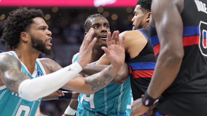Feb 9, 2026; Charlotte, North Carolina, USA;  Charlotte Hornets forward Moussa Diabaté (14) and forward Miles Bridges (0) are ejected after a fight with Detroit Pistons center Jalen Duren (0) and forward/center Isaiah Stewart (28) during the second half at Spectrum Center. Mandatory Credit: Jim Dedmon-Imagn Images