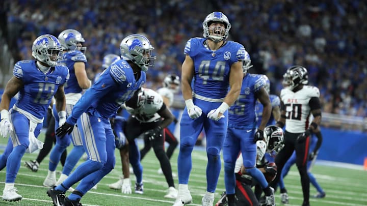 Detroit Lions linebacker Malcolm Rodriguez (44) celebrates his tackle on Atlanta Falcons cornerback Mike Hughes (21) during second-half action at Ford Field in Detroit on Sunday, Sept. 24, 2023.